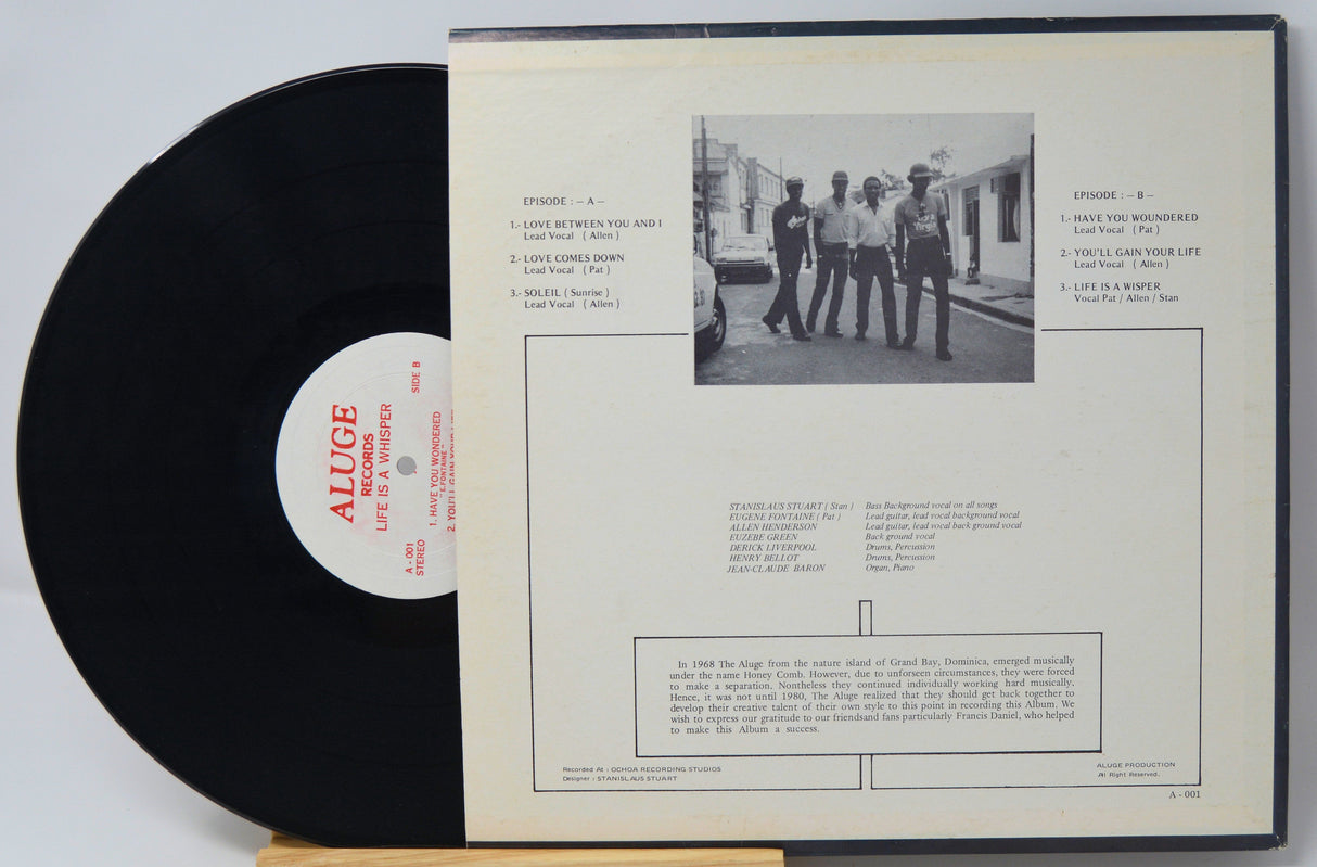 Back cover of The Aluge 'Life Is a Whisper' vinyl LP with tracklist and band photo