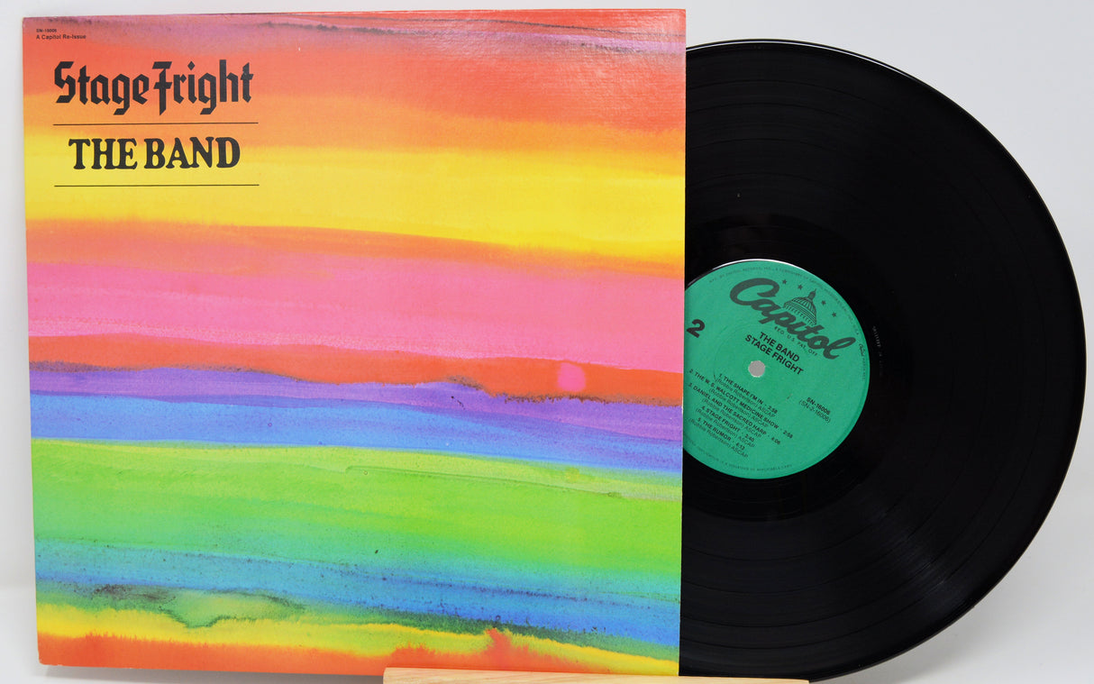Vinyl record with a colorful cover titled 'Stage Fright' by The Band on a white background.