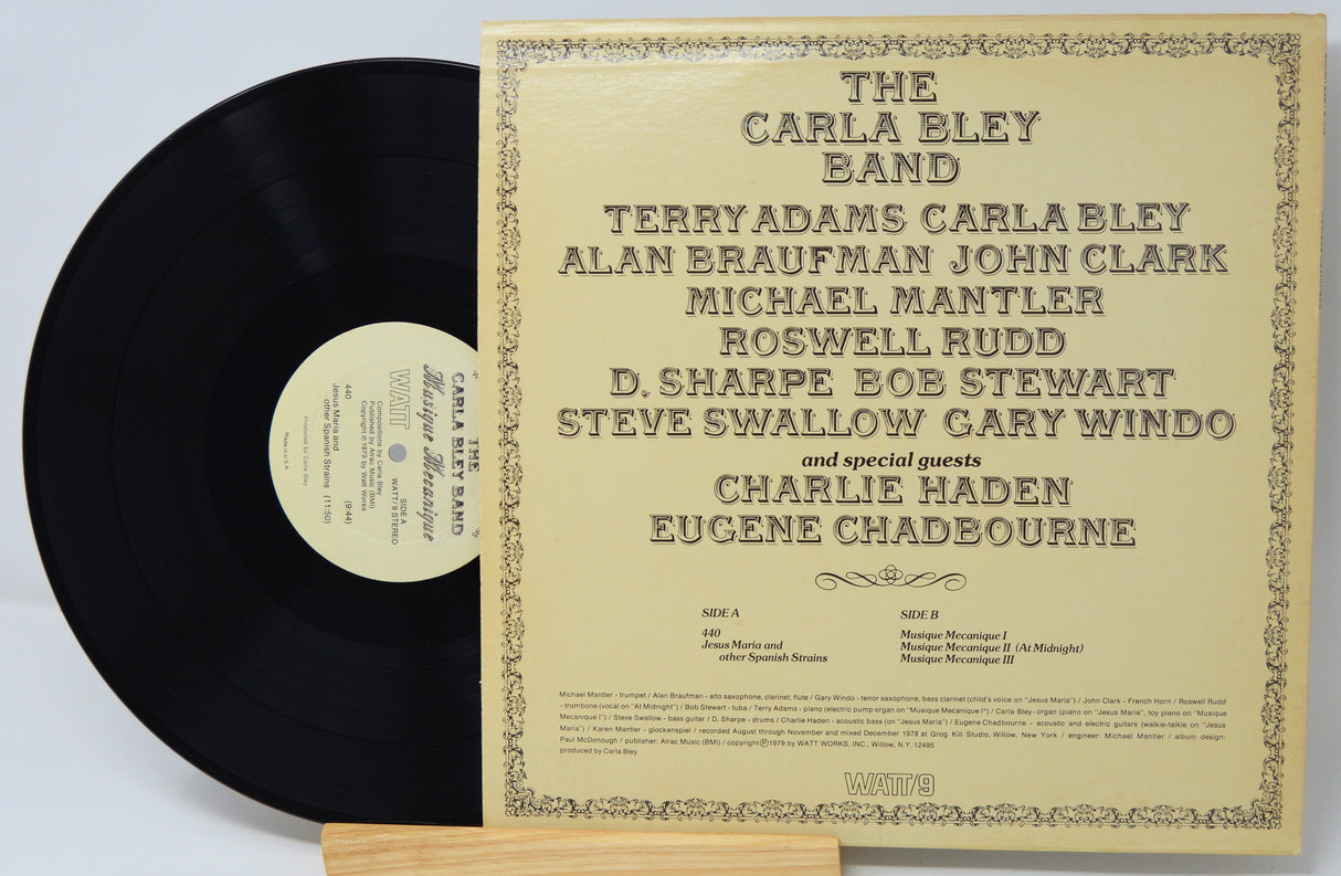 Back cover of The Carla Bley Band - Musique Mecanique vinyl LP showing band members and track list