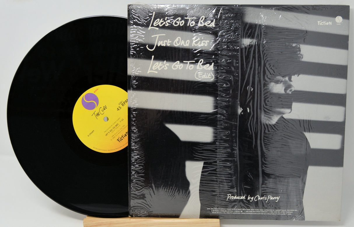 The Cure Let's Go To Bed vinyl record with original monochrome sleeve and stripes artwork