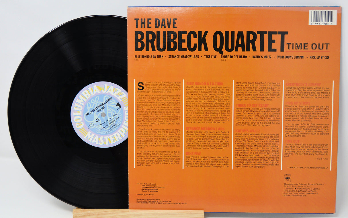 Back cover and vinyl record of The Dave Brubeck Quartet's 'Time Out' jazz album with tracklist and liner notes