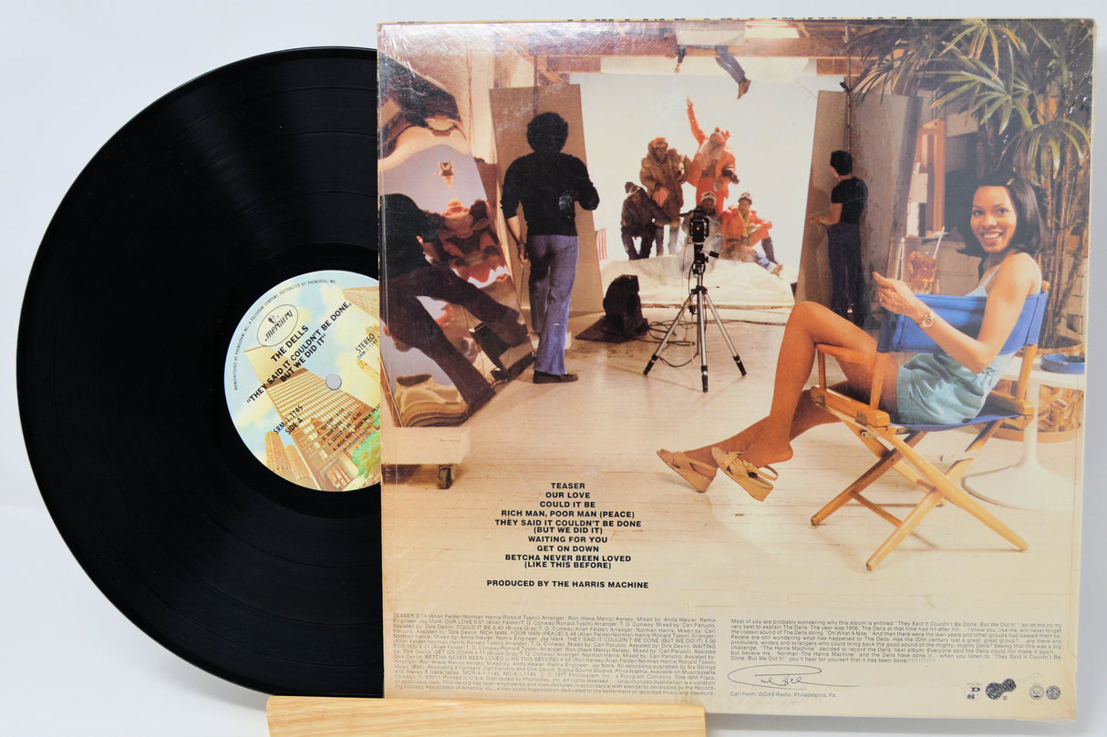 Vinyl record with cover showing a scene from a movie or TV show, featuring people in a room.