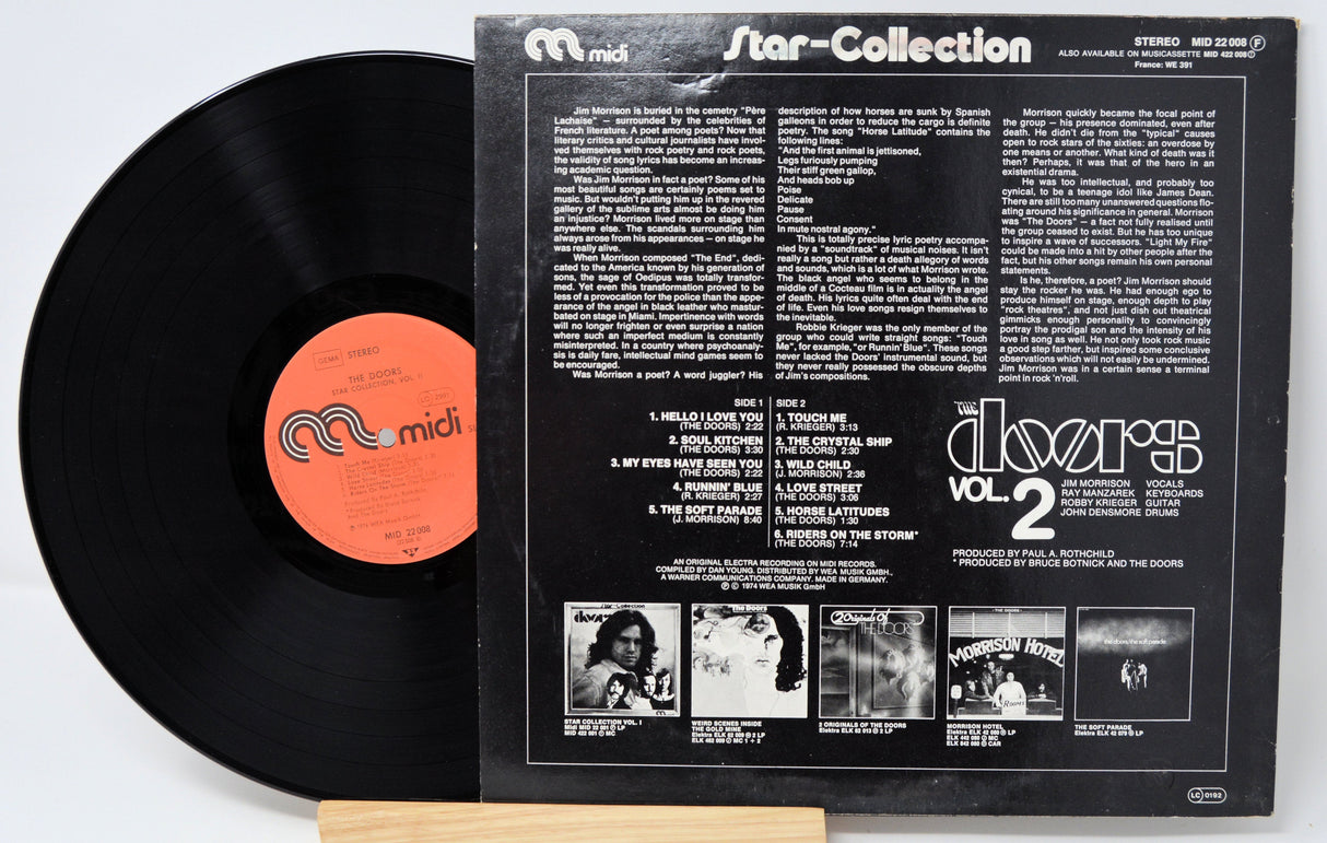 Back cover and vinyl record of The Doors Star Collection Vol. 2 displaying tracklist and liner notes