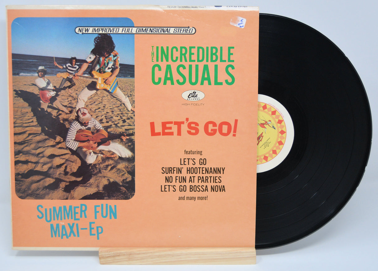 Front cover of The Incredible Casuals Let's Go! maxi-EP vinyl featuring band on the beach