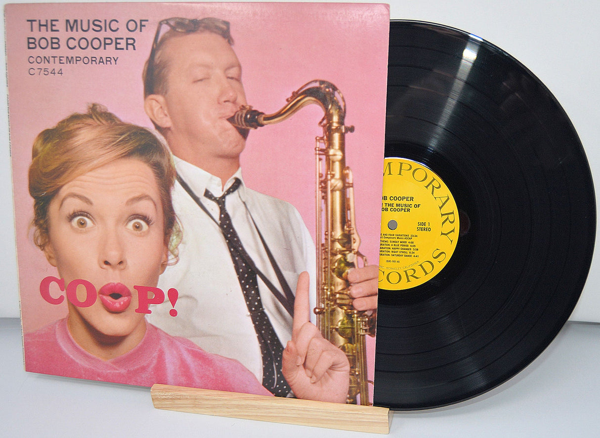 Front album cover of The Music of Bob Cooper vinyl record featuring a woman and saxophonist