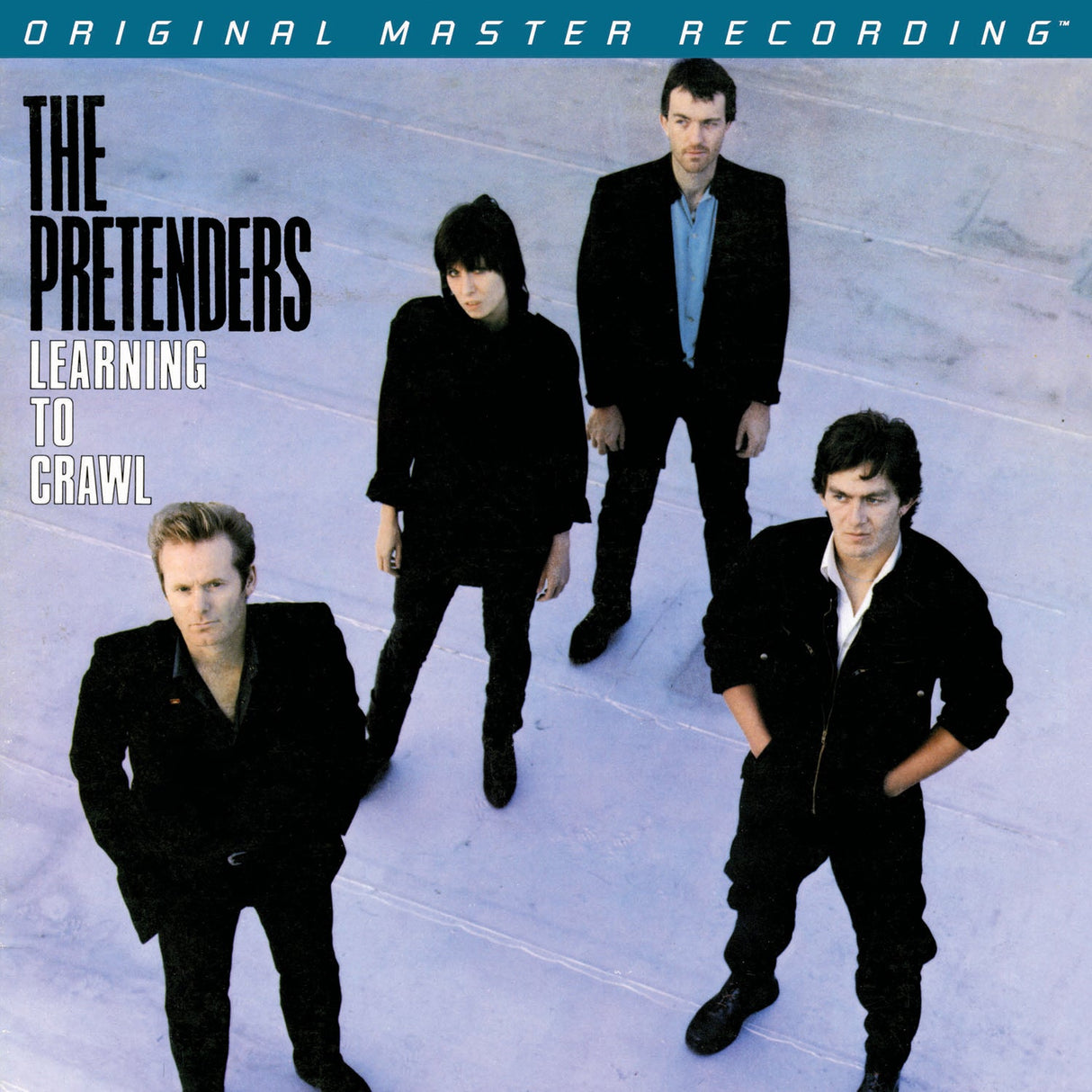 Album cover of 'Learning to Crawl' by The Pretenders featuring four band members.