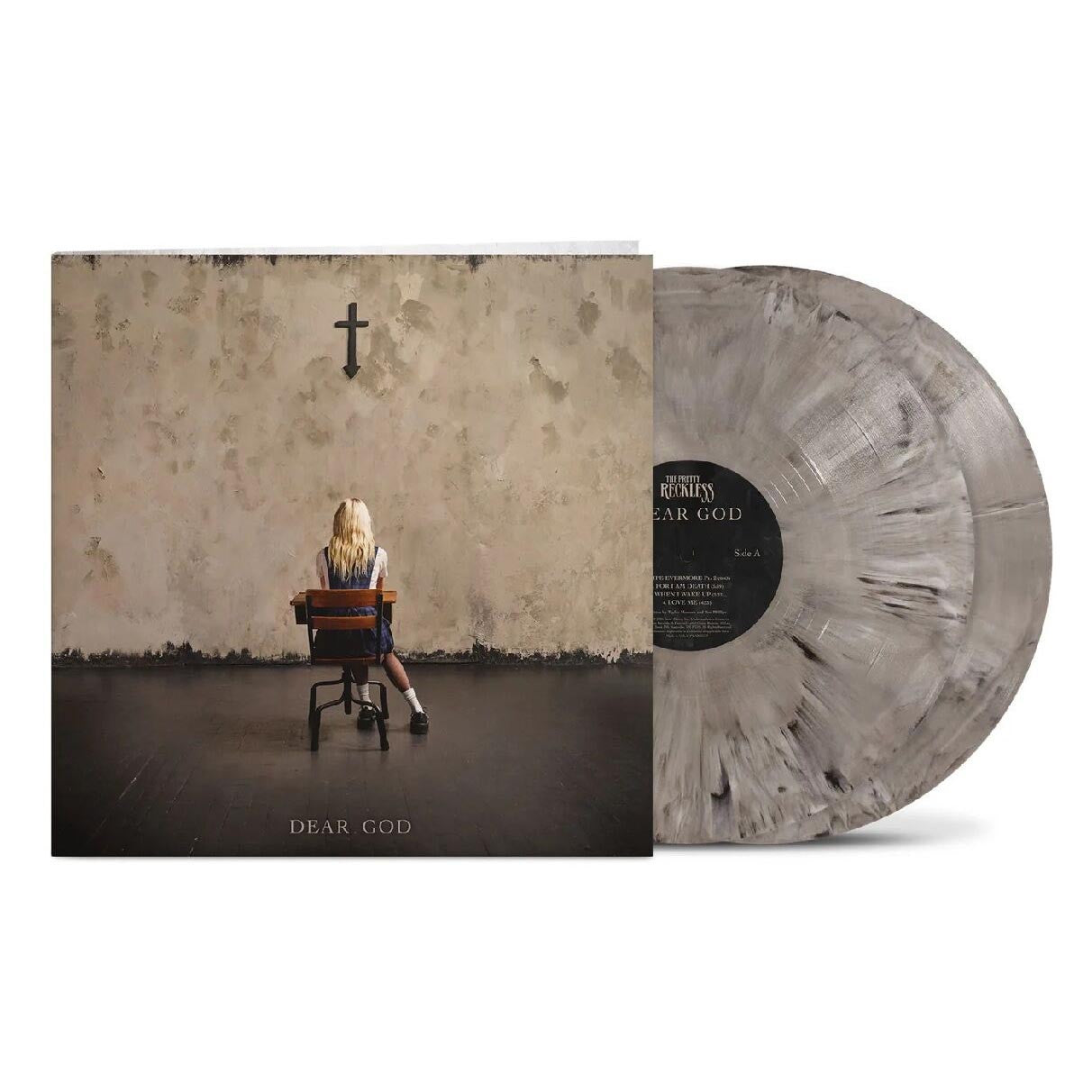 Vinyl record with cover featuring a person sitting on a chair against a wall with a cross.