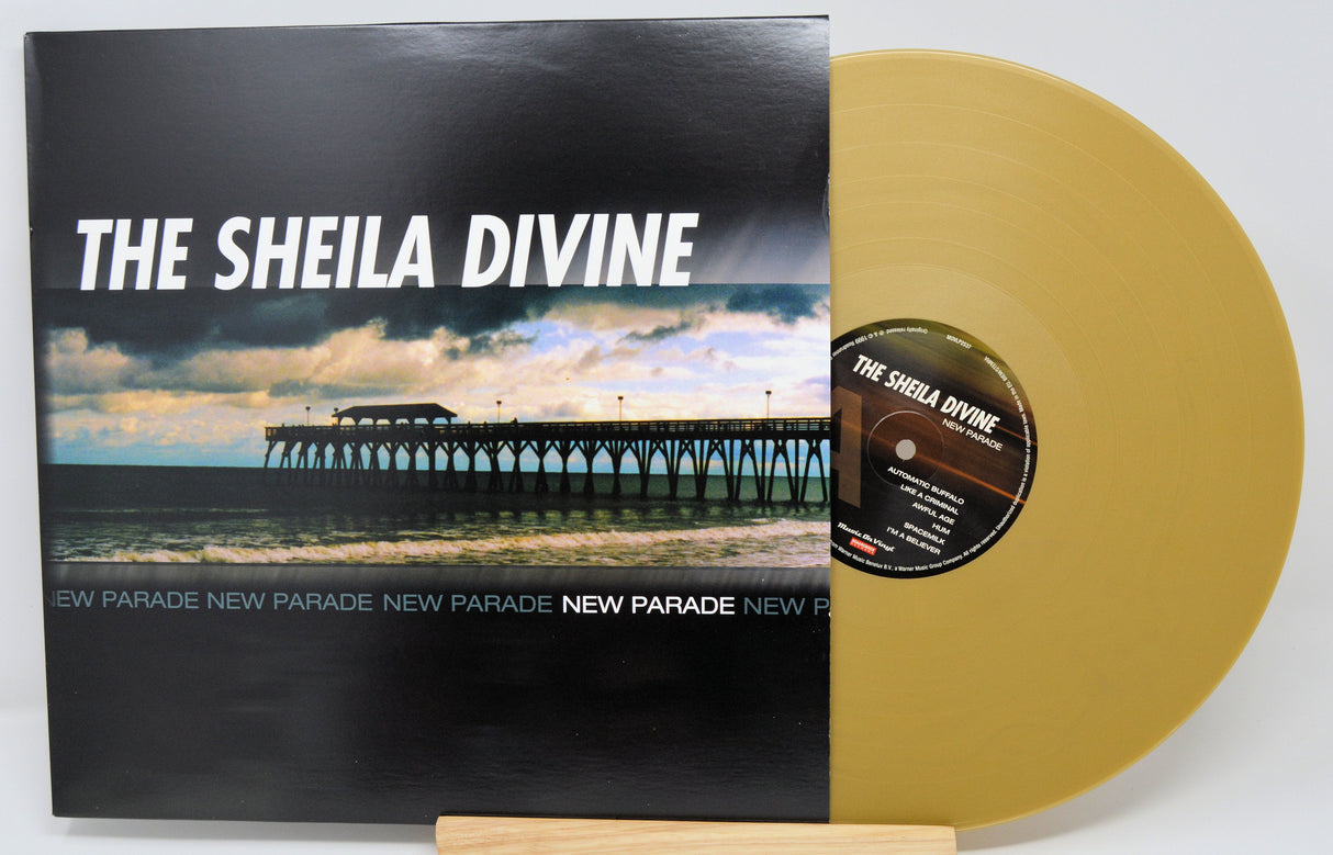 Front cover and gold vinyl of The Sheila Divine's New Parade album with pier photograph