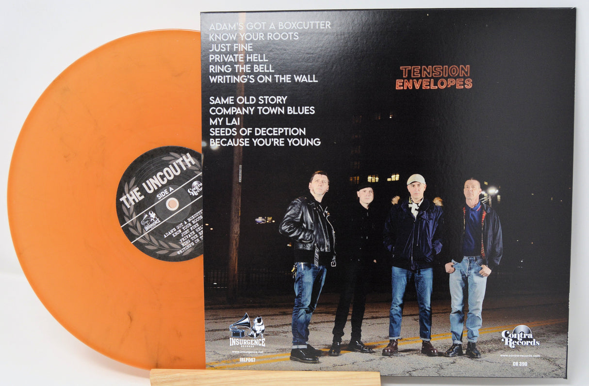 Back cover of The Uncouth's 'Tension Envelopes' album with orange vinyl and band members posing