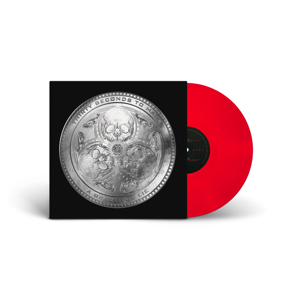 Vinyl record with a red disc and black cover featuring intricate designs.