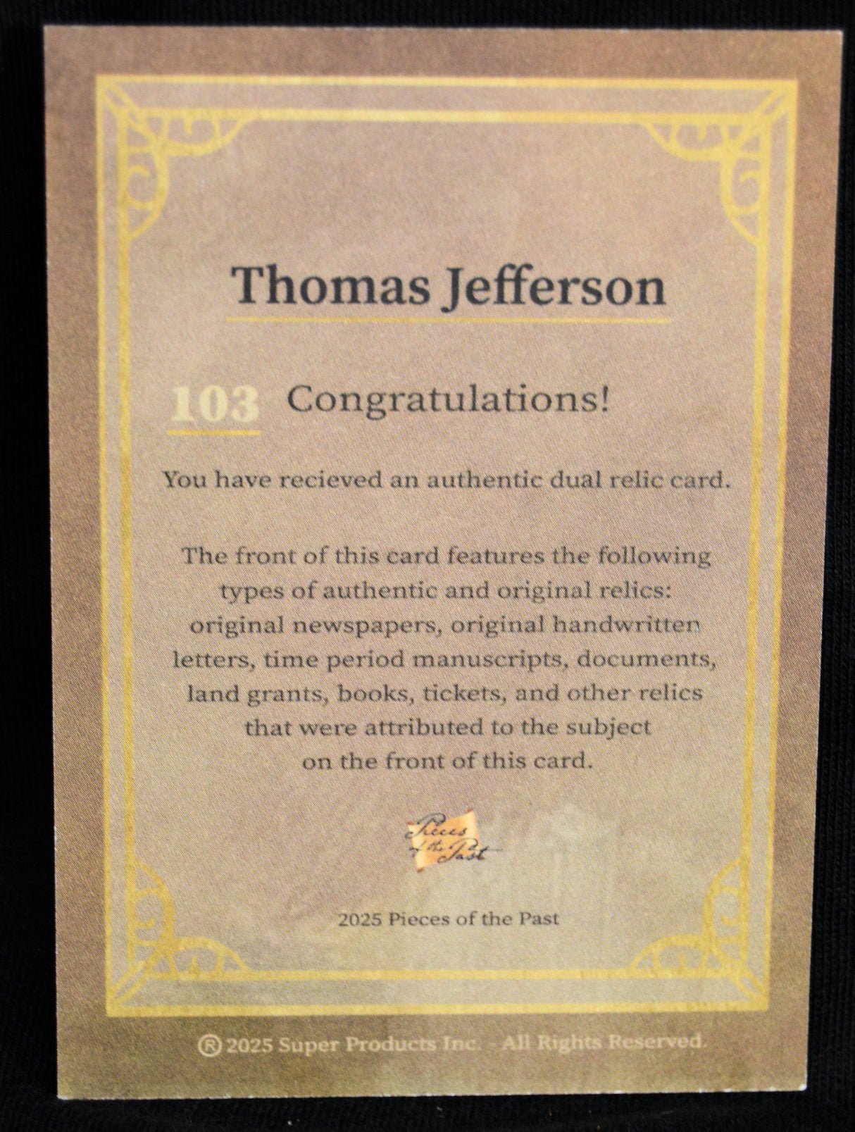 Back of Thomas Jefferson dual relic card detailing authenticity and relic types