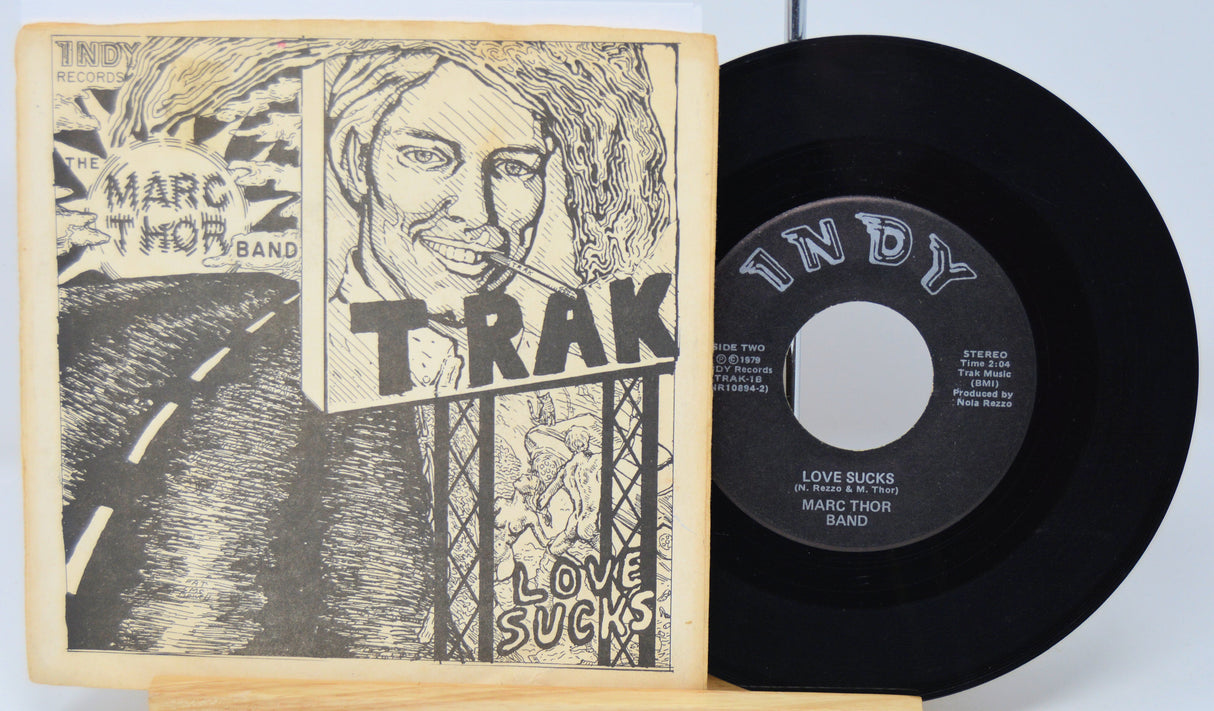 Vinyl record with cover featuring a stylized illustration of a person and text.