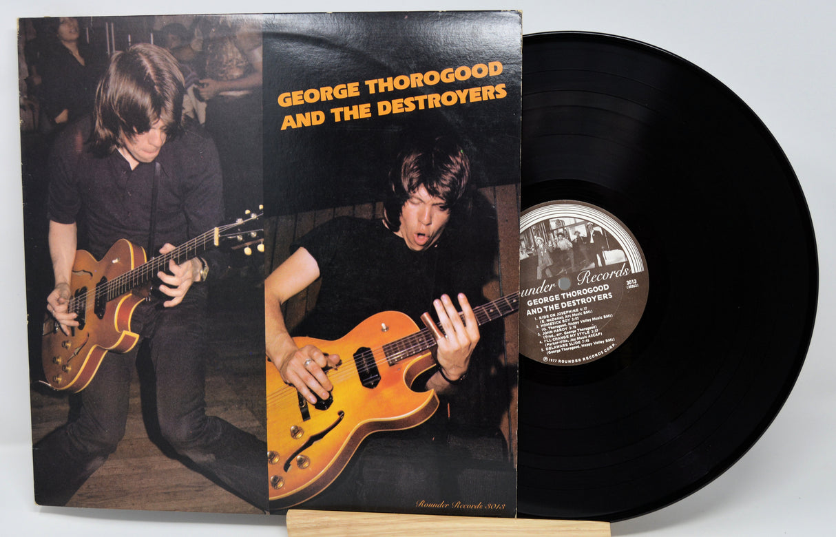 Vinyl record with cover featuring George Thorogood and The Destroyers, showing a person playing guitar.