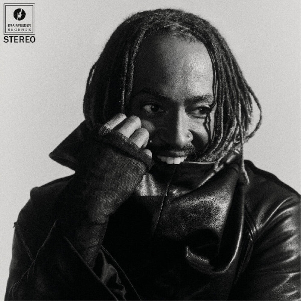 Black and white album cover with a phote of Thundercat wearing a leather jacket and holding a phone to their ear, featuring Brainfeeder Music Records logo.