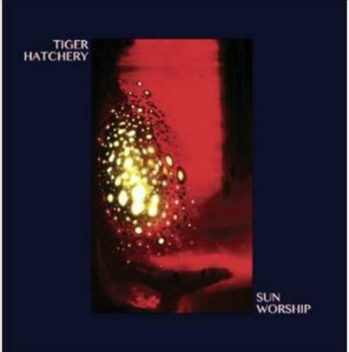 Sun Worship album cover by Tiger Hatchery featuring abstract golden lights on a red and black background