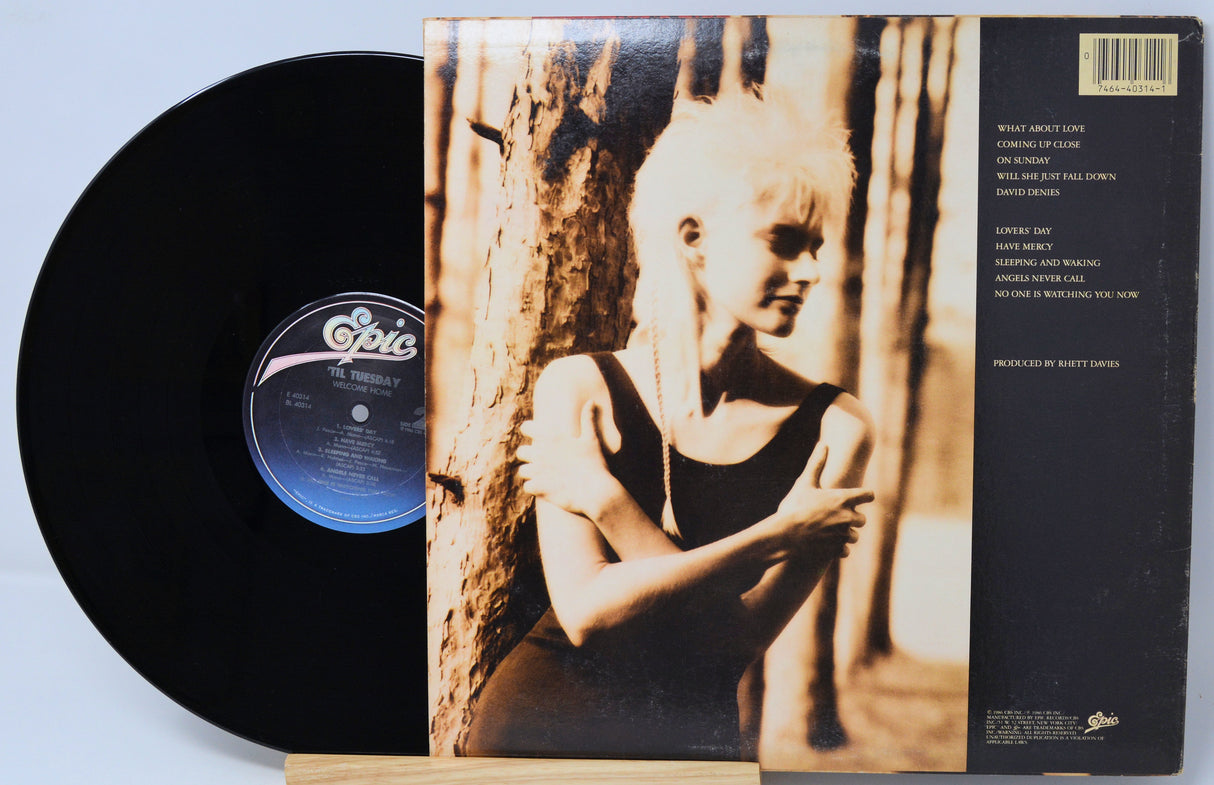 Vinyl record with cover featuring a black and white image of a child against a textured background.