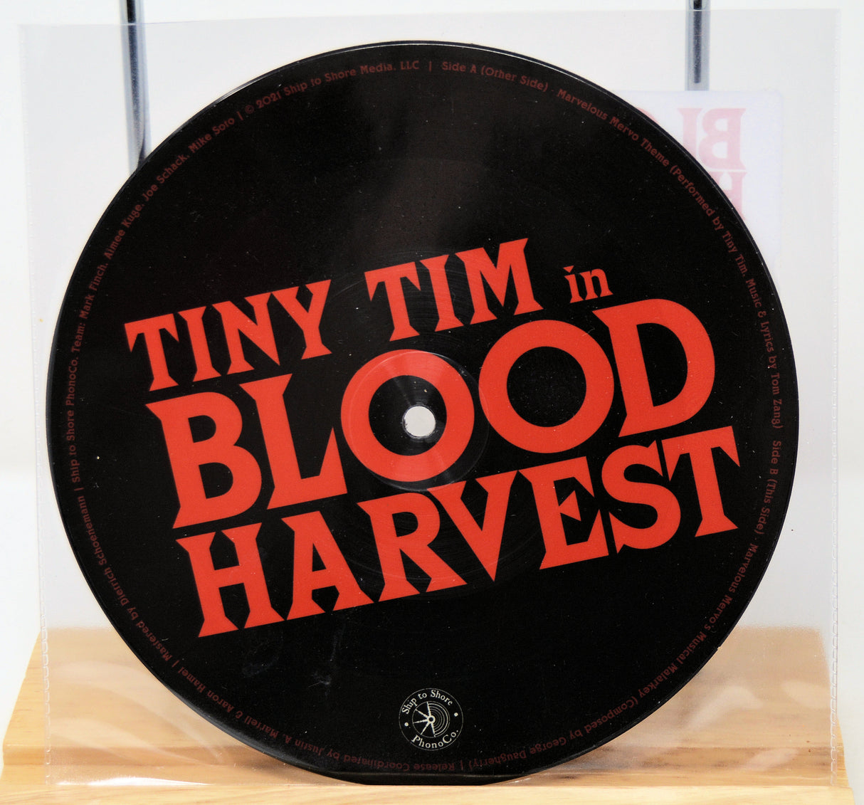 Vinyl record with 'Tiny Tim in Blood Harvest' text on a stand