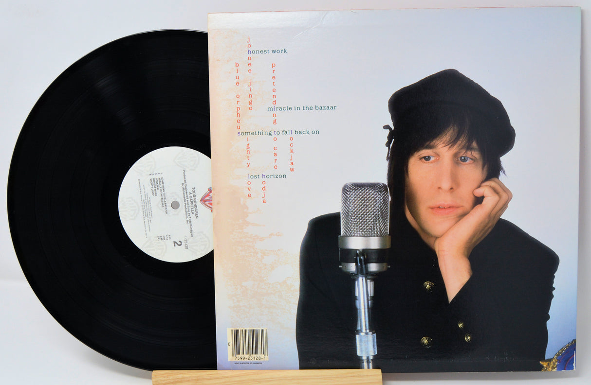 Vinyl record with cover featuring a person and microphone, on a white background