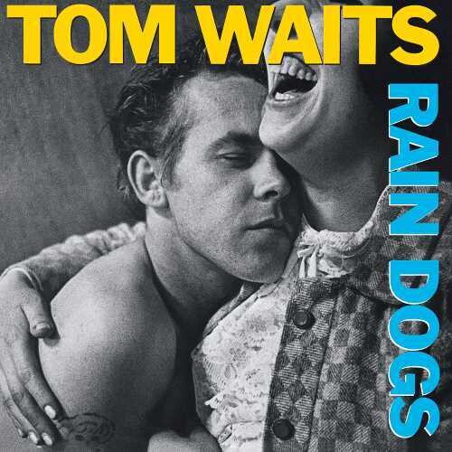 Album cover for Tom Waits' Rain Dogs featuring a black and white photograph of Tom Waits with the title text overlaid in blue.