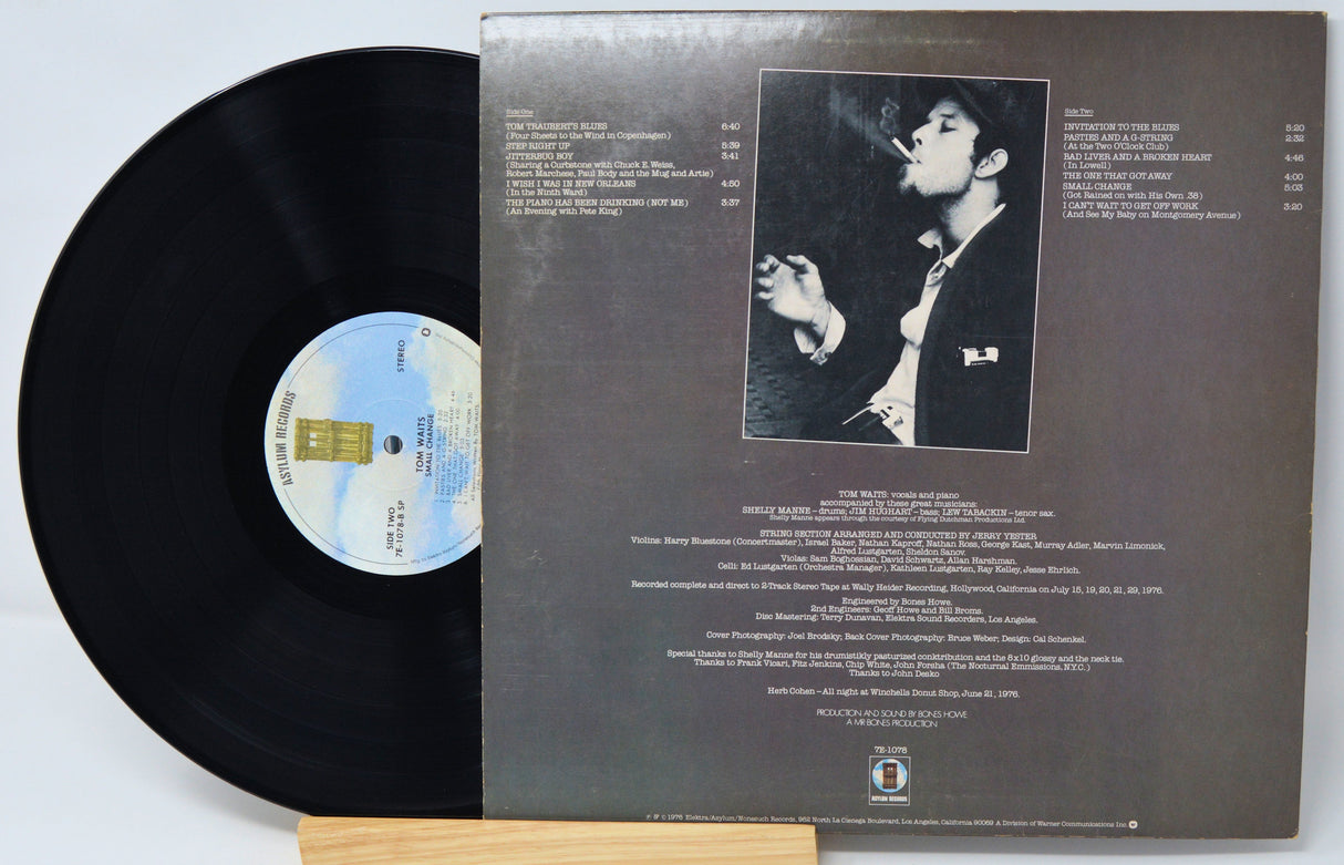 Vinyl record 'Tom Waits Small Change' with cover featuring a black and white portrait and text on a light gray background