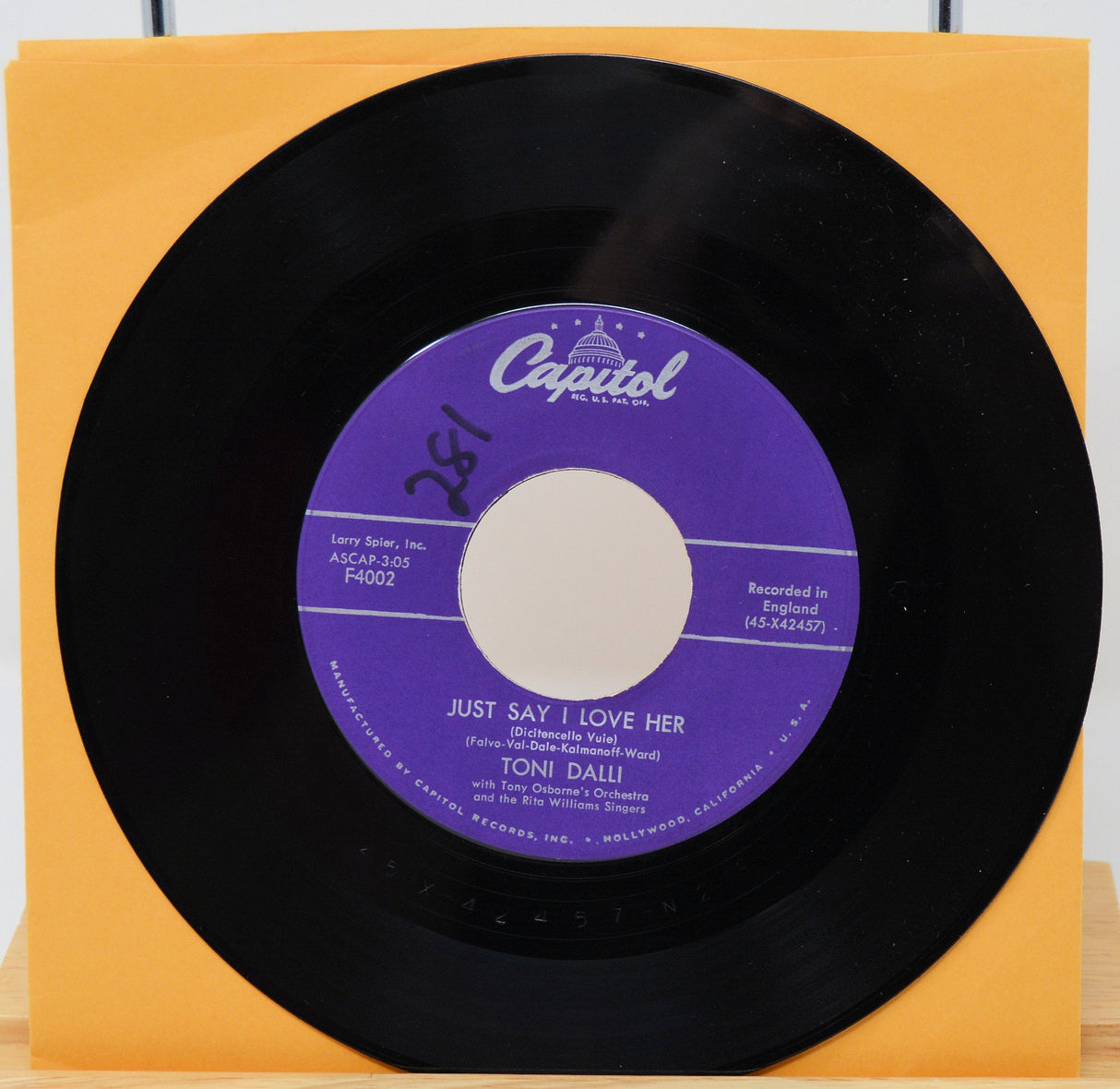 Vintage Capitol 45 record by Toni Dalli featuring Just Say I Love Her with a purple label
