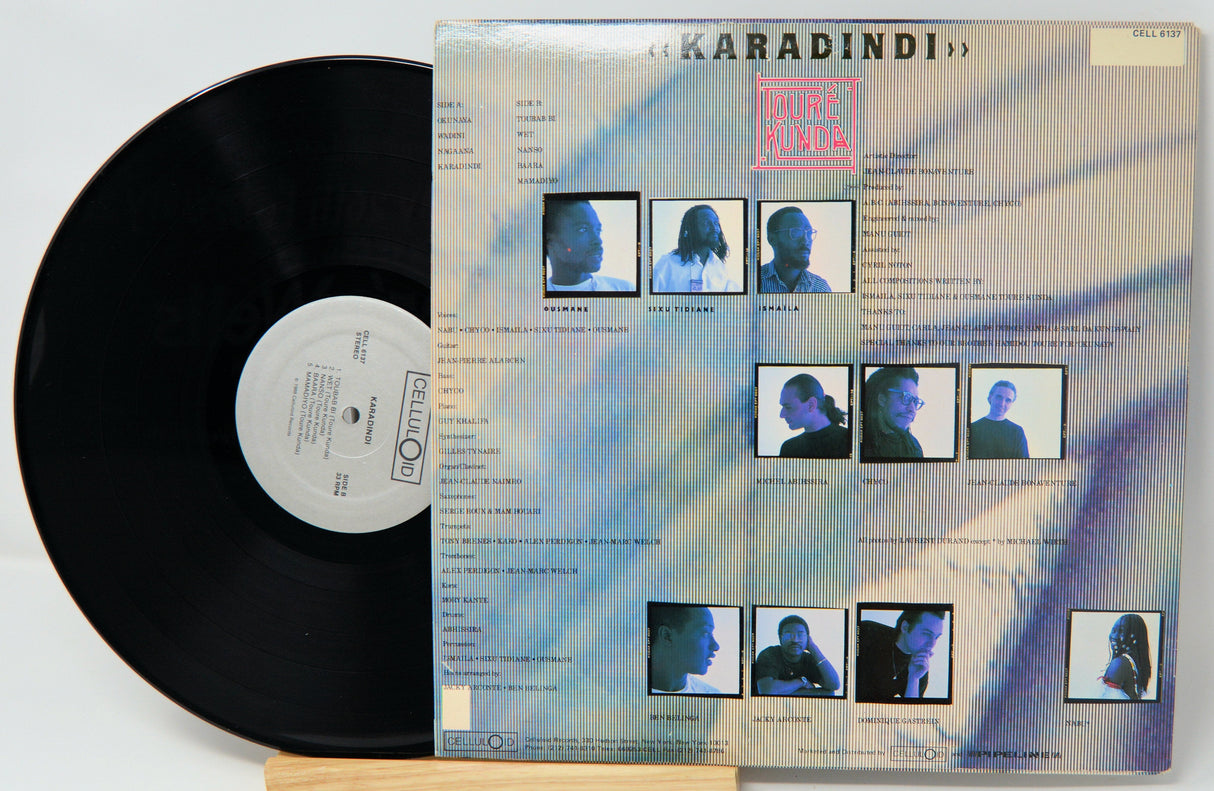 Back cover and vinyl record of Toure Kunda's Karadindi LP featuring band member photos and track listing