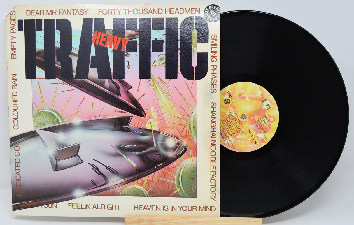 Vinyl record with colorful cover featuring text and graphics on a white background