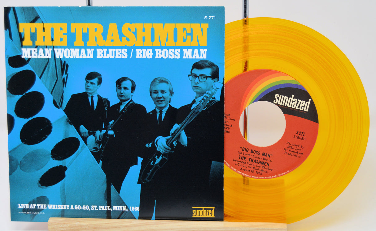 Vinyl record with blue cover featuring 'The Trashmen' and a yellow record with a red label.