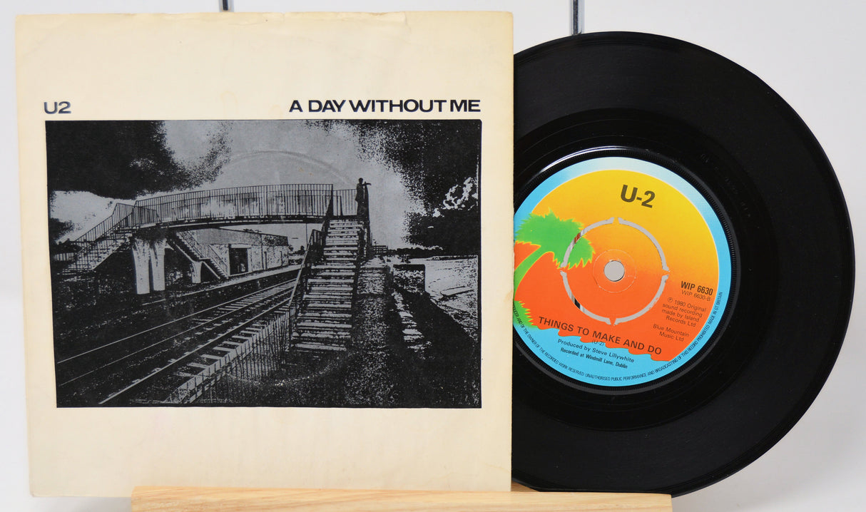 Vinyl record and cover titled 'A Day Without Me' by U2