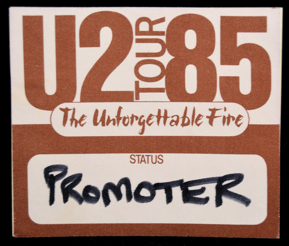Backstage Pass for U2 Tour 85 with 'The Unforgettable Fire' and 'Promoter' text.