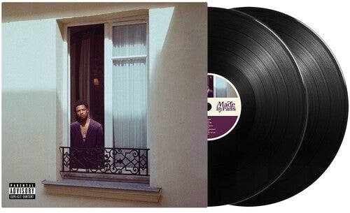 Double vinyl album featuring an artist looking out of a window with an elegant iron balcony