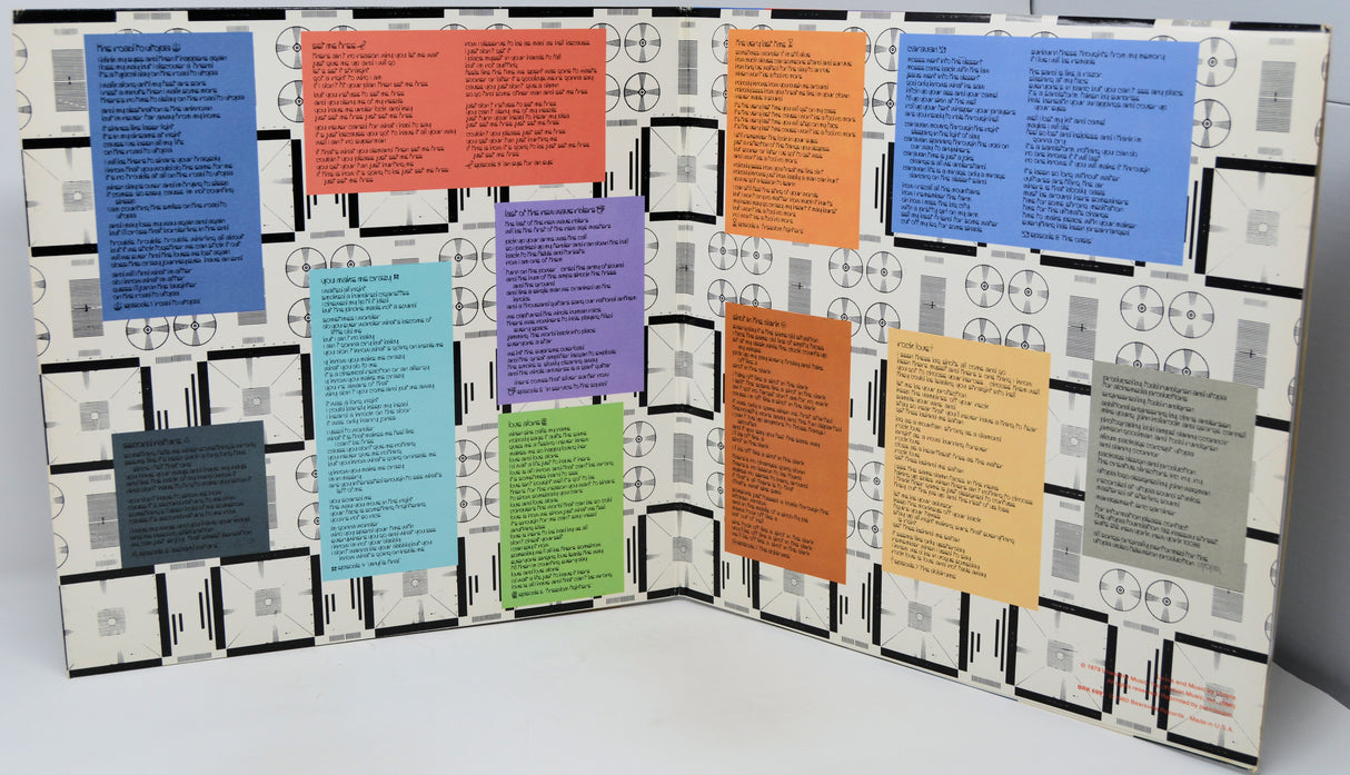 Colorful posters on a geometric-patterned board