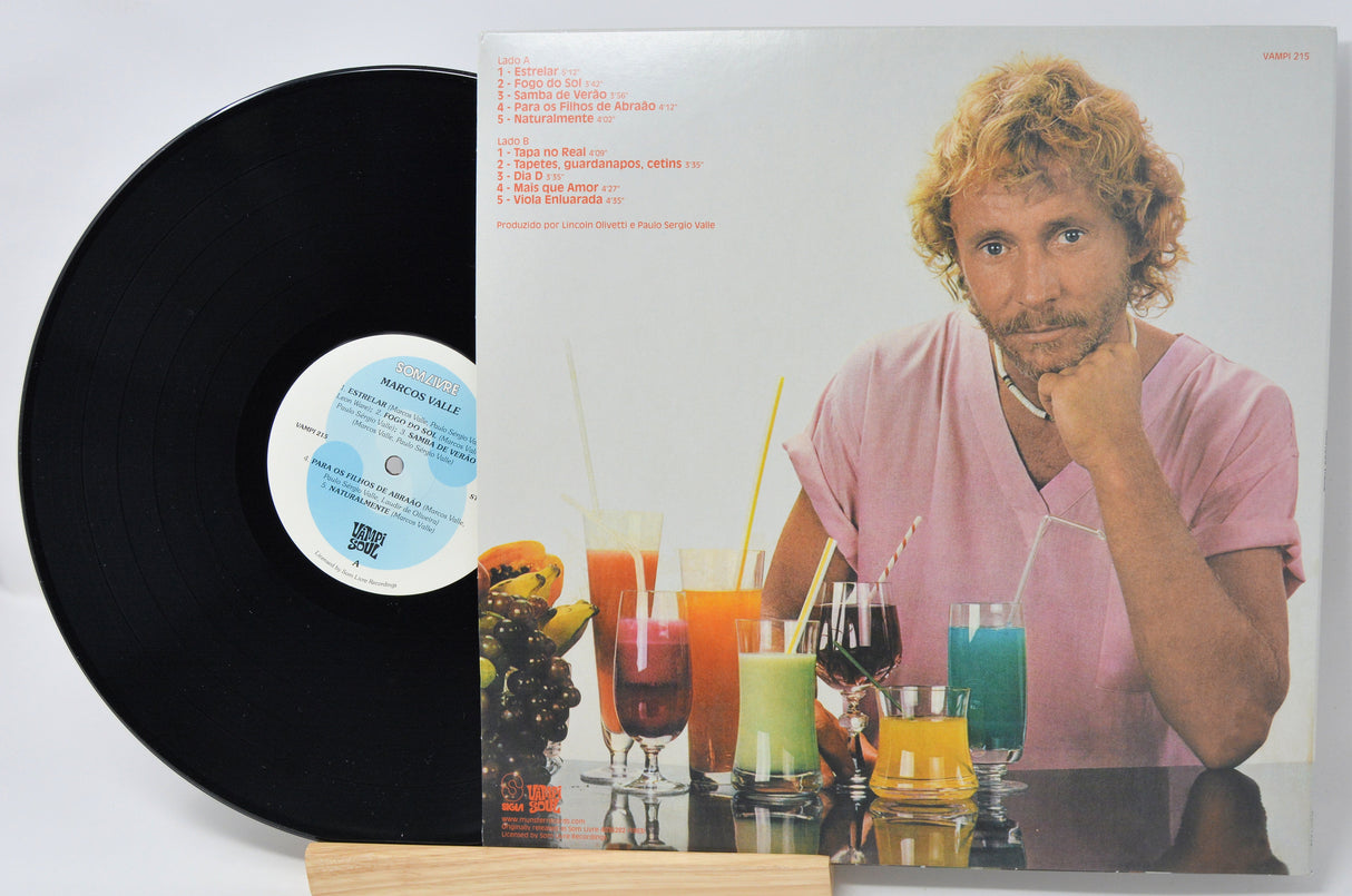 Vinyl record with a colorful album cover featuring a person and drinks.