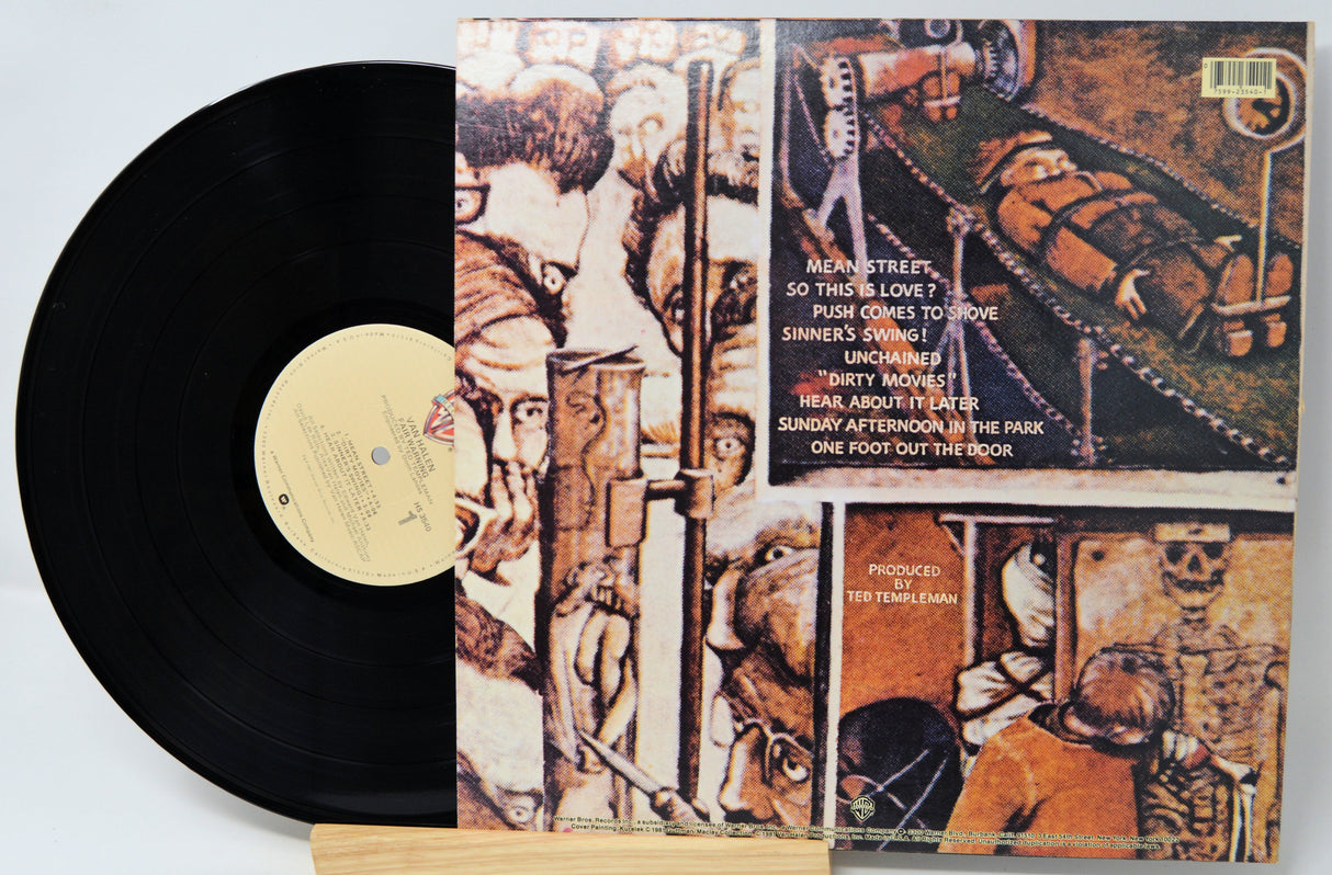 Vinyl record with a detailed cover featuring artistic illustrations and text.