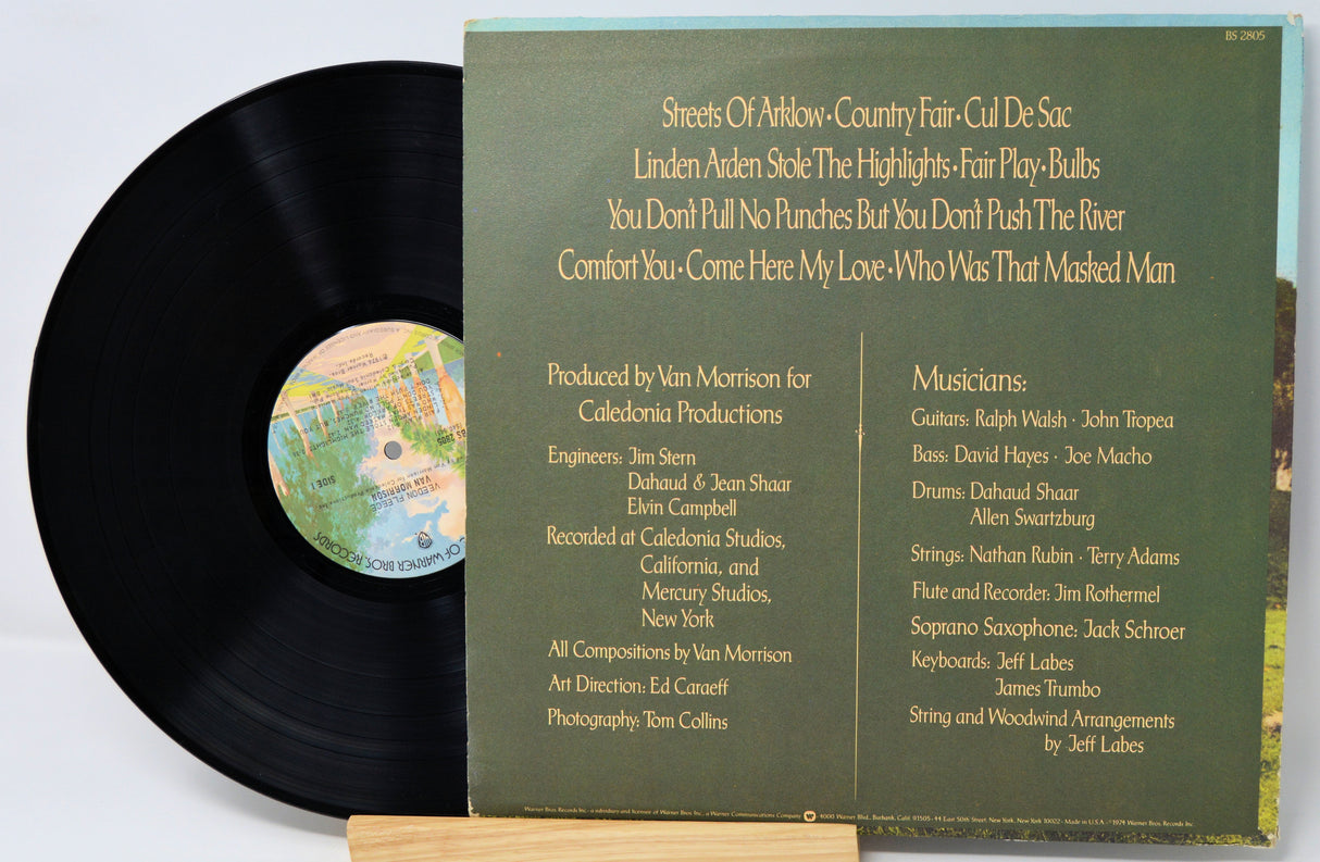 Vinyl record with cover displaying text and a map on a light gray background