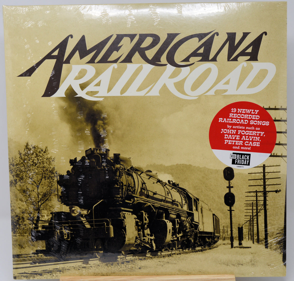 American Railroad vinyl record album cover, sealed in plastic shrink wrap. The cover features a sepia-toned photograph of a steam locomotive train, with the title 'AMERICAN RAILROAD' in large stylized lettering.
