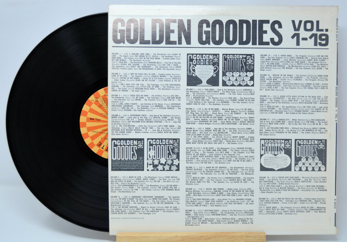Vinyl record with a sleeve titled 'Golden Goodies Vol. 1-19' on a light blue background.