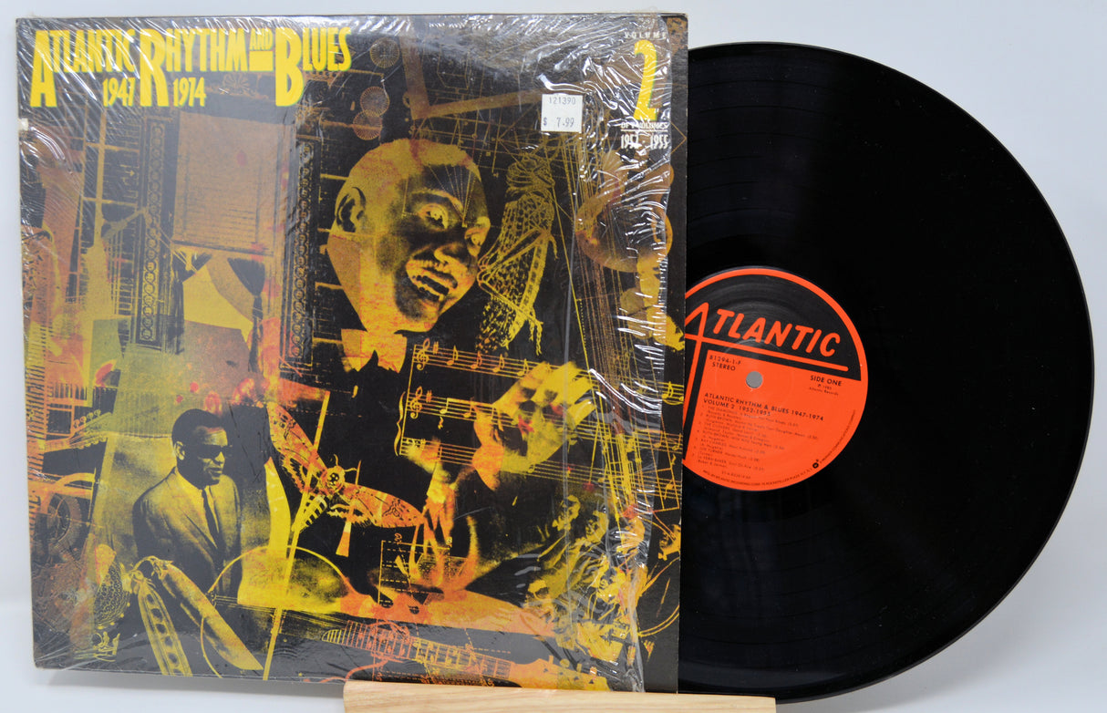 Vinyl record with cover featuring a stylized illustration of a man and text on a white background