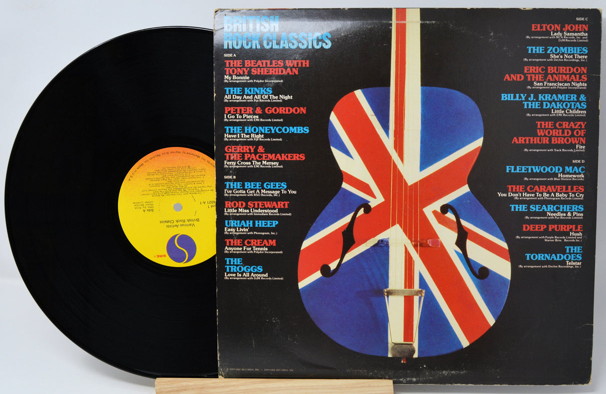 Vinyl record and cover with British rock classics on a white background