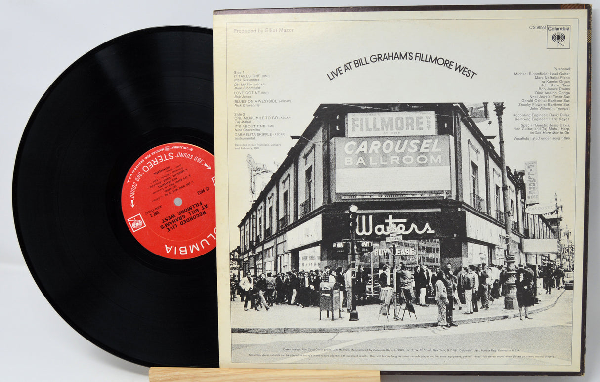 Vinyl record with cover featuring a portrait of a man and album title 'His 12 Greatest Hits'.