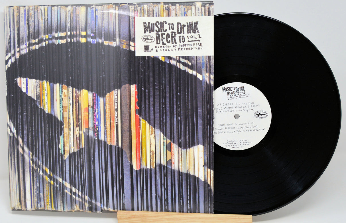 Vinyl record with colorful sleeve and visible label on a white background