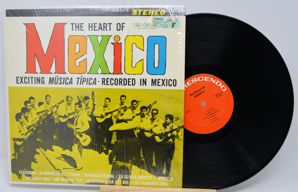 Vinyl record with colorful cover featuring a band and text 'The Heart of Mexico'.