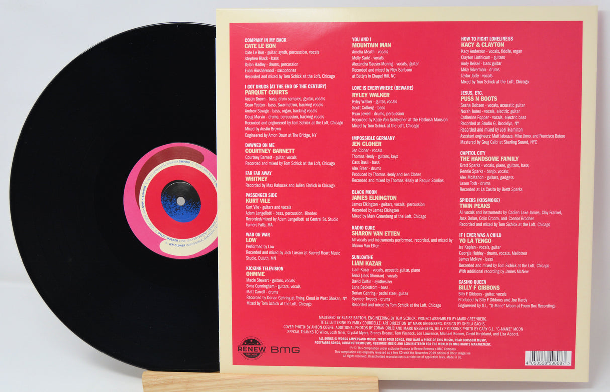 Vinyl record with a pink label on a white background