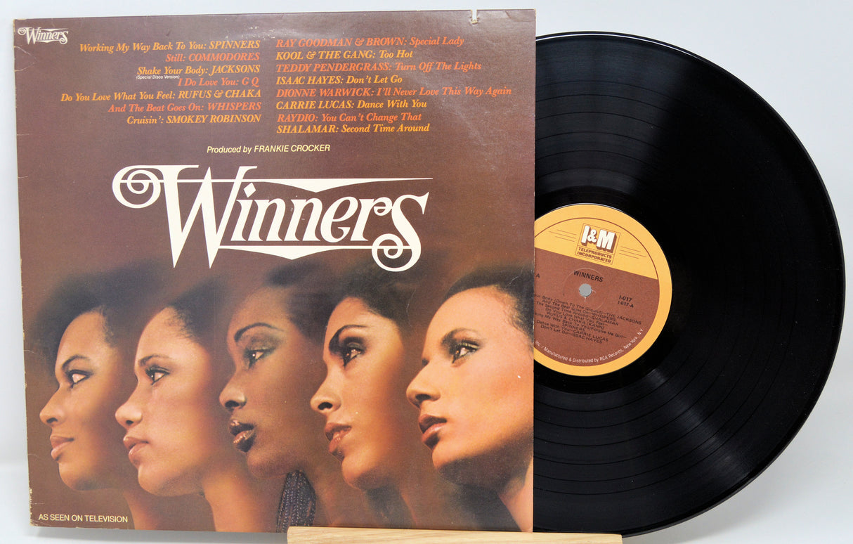 Vinyl record and cover titled 'Winners' with a focus on the album art and text.