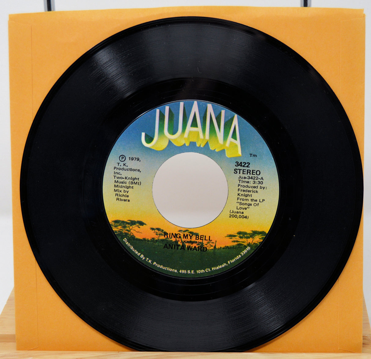 Vinyl record with 'Juana' label on a yellow background