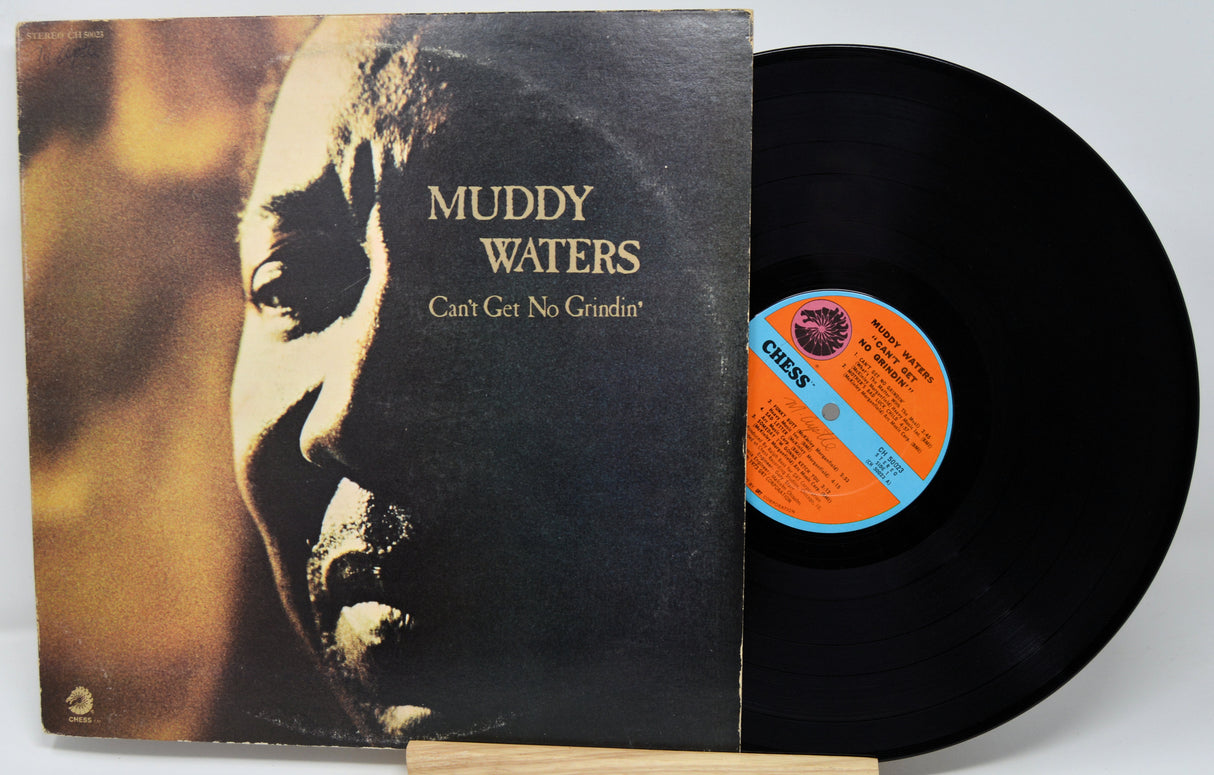 Vinyl record and cover with 'Muddy Waters' album on a white background