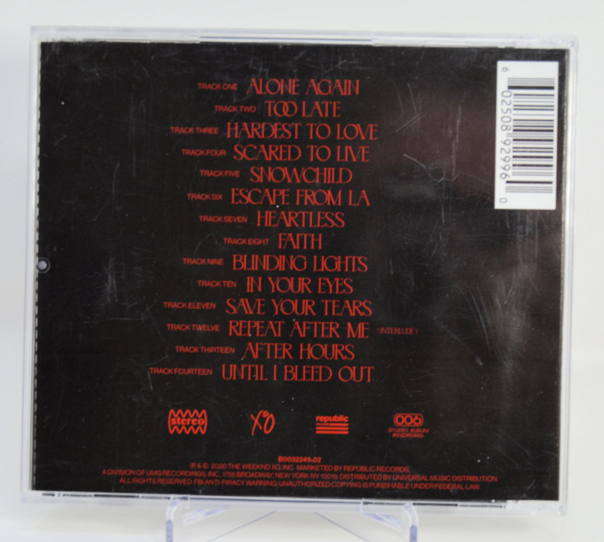 Back cover of a Signed music CD, The Weeknd - After Hours, with tracklist and logos on a white background