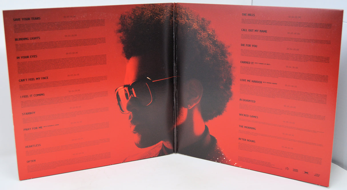 Album cover with a silhouette of a person wearing sunglasses on a red background