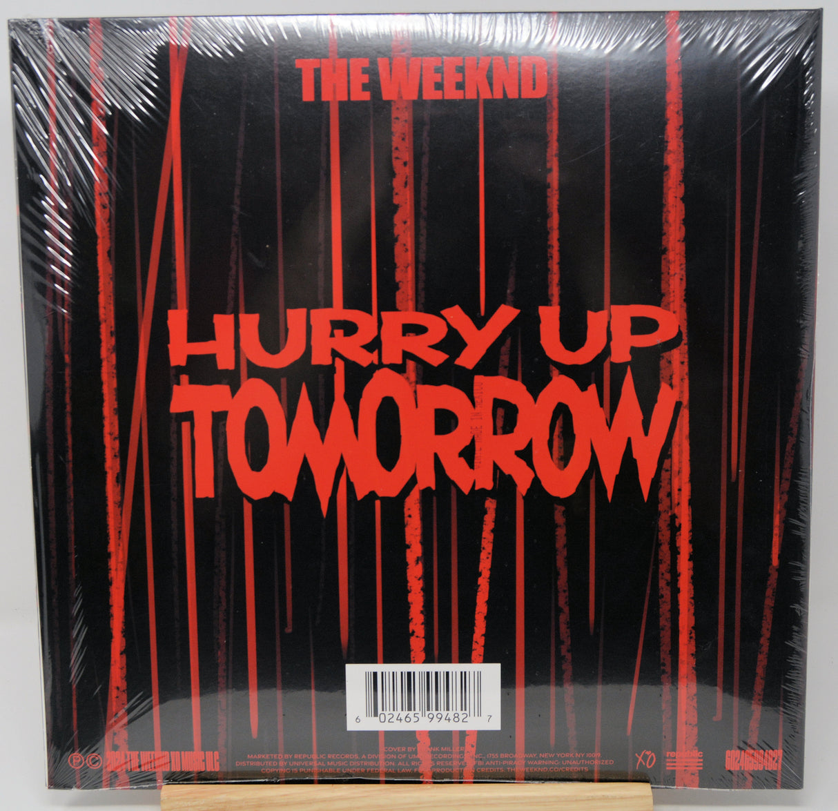 Vinyl record cover for 'Hurry Up Tomorrow' by The Weeknd with red text on a black background.