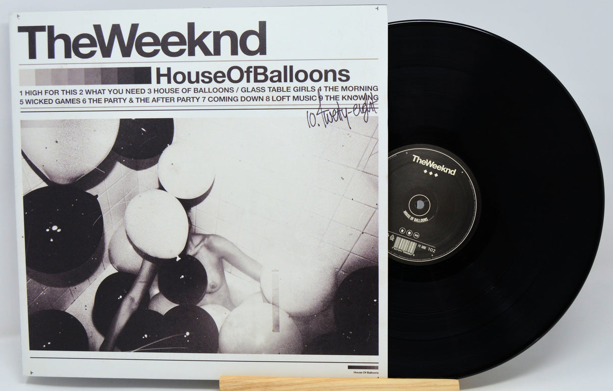 Vinyl record and cover titled 'House Of Balloons' by The Weeknd on a white background